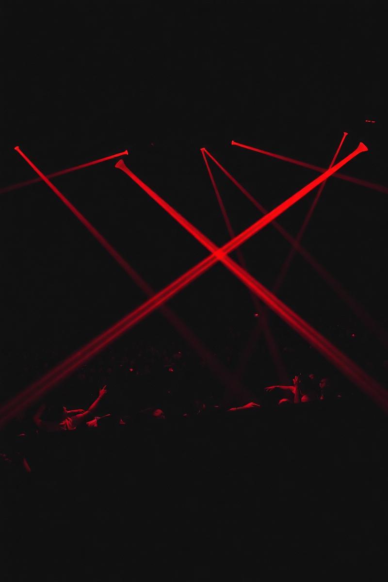 Red laser beams over a Houston nightlife crowd